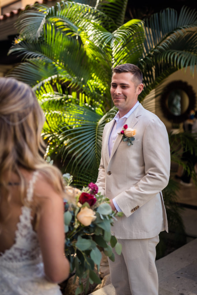 a groom seeing his bride in a tropical first look location