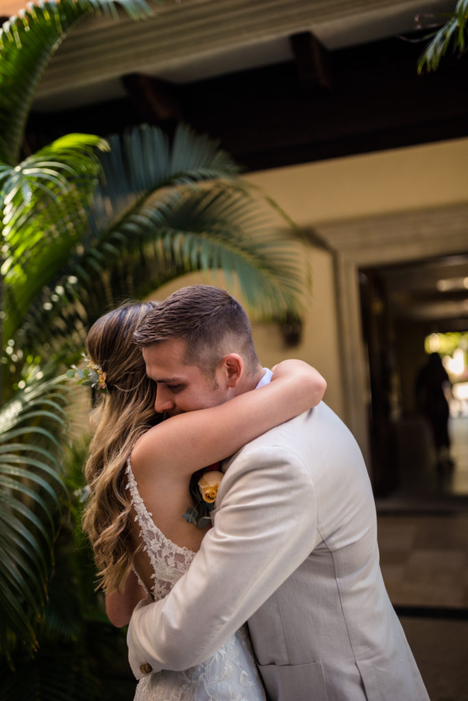 bride and groom embracing before their wedding ceremony