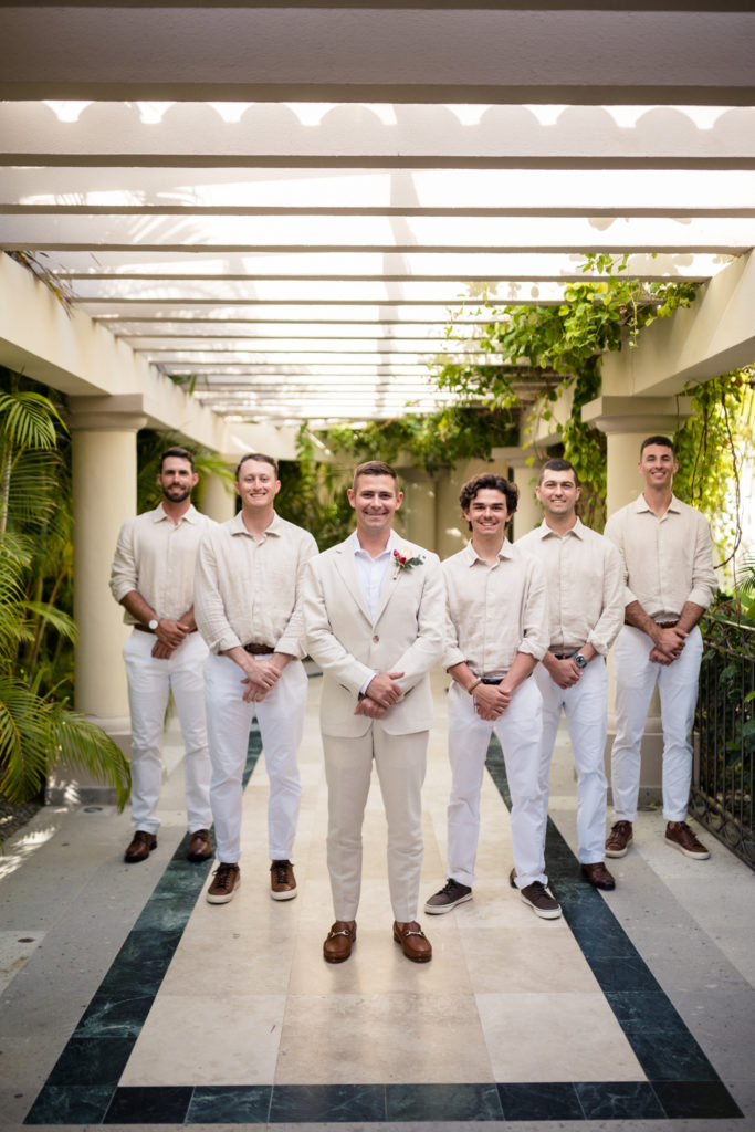 groomsmen in tan and white