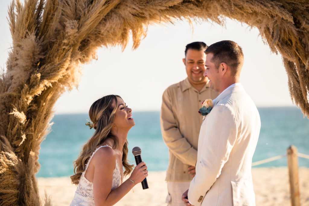 bride crying during wedding vows in cabo