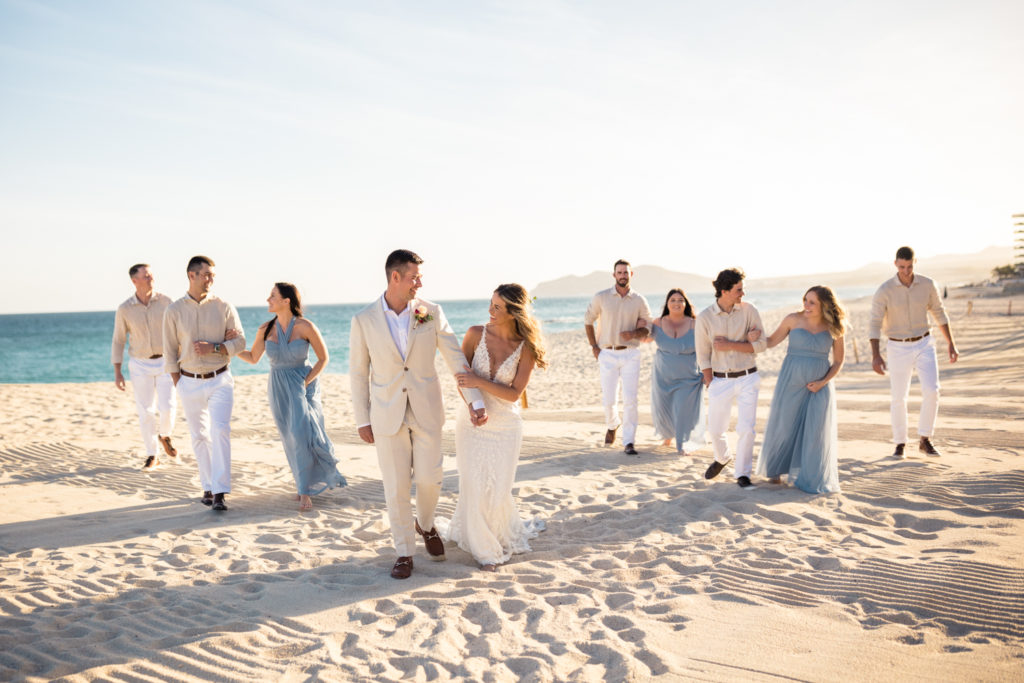 wedding party walking on the beach in cabo