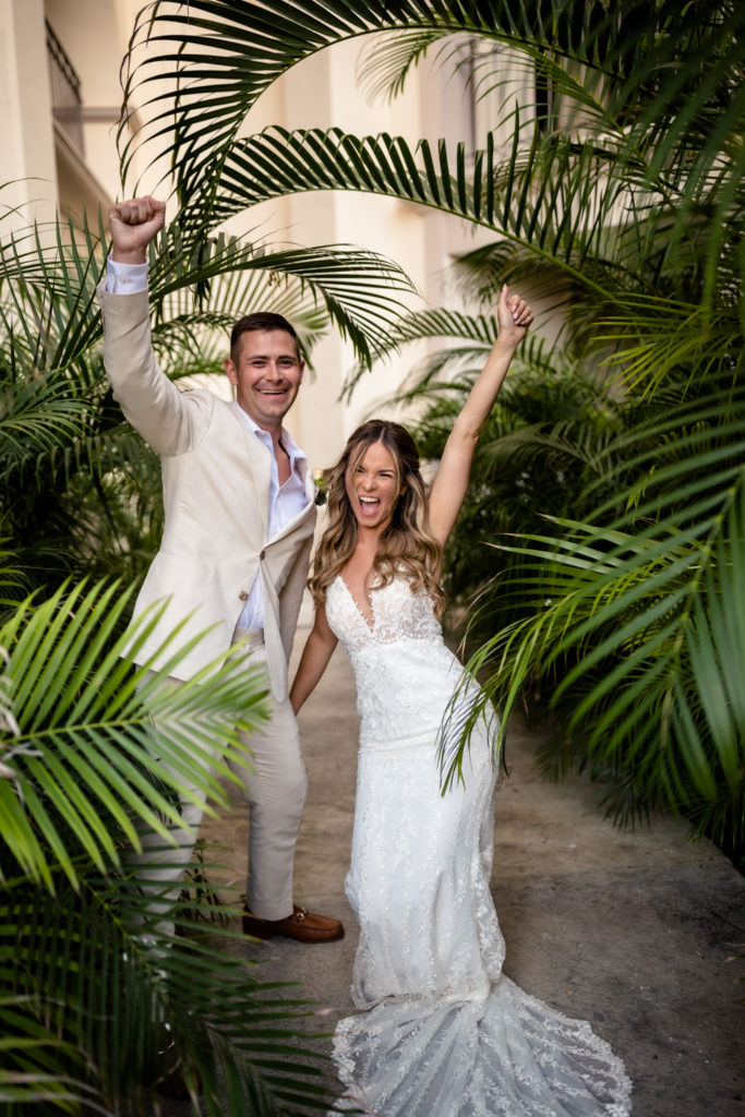 tropical mexico wedding photos with bride and groom cheering
