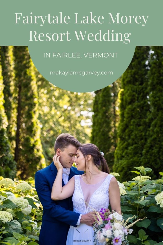 A groom embraces his bride from behind as they stand in the garden of Fairlee, Vermont. Image overlaid with text that reads Fairytale Lake Morey Resort Wedding in Fairlee, Vermont