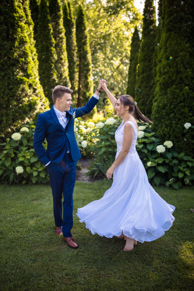 bride and groom dancing in garden