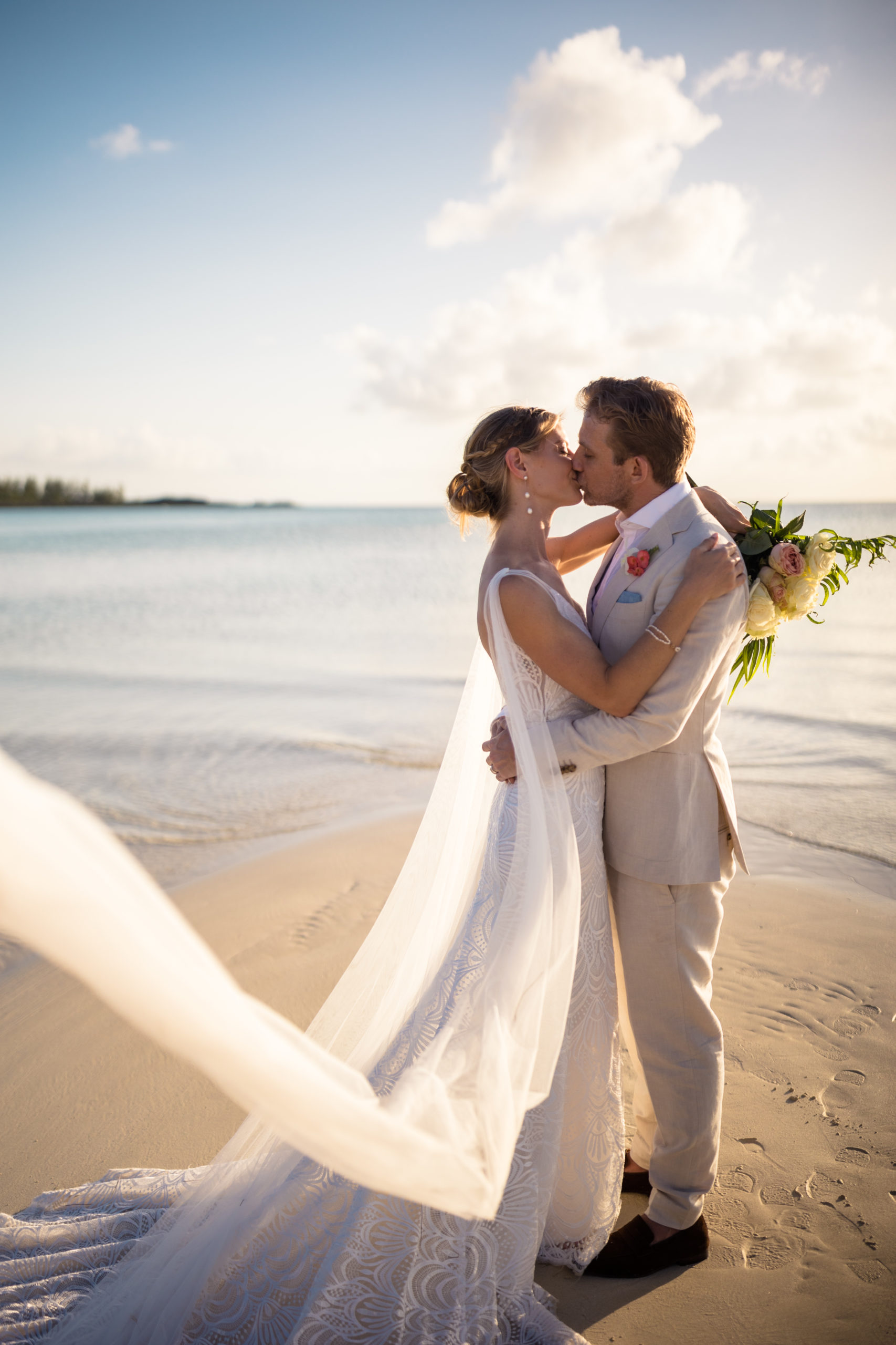 bride and groom kissing in the bahamas
