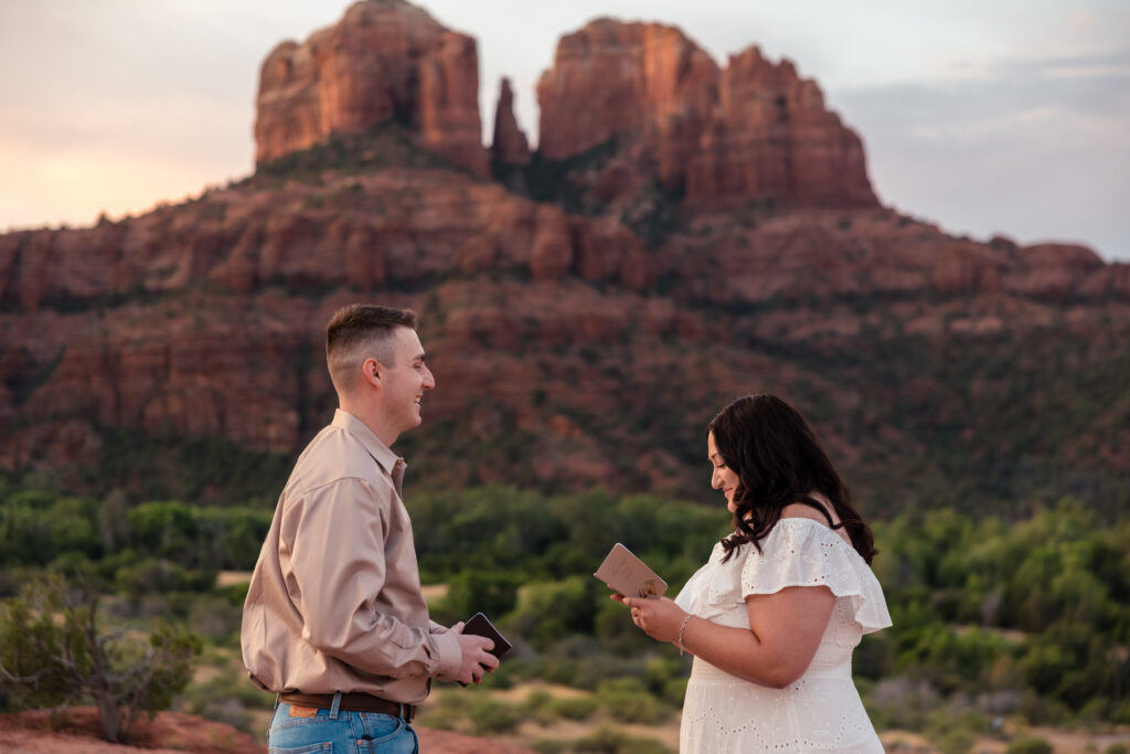 A couple is exchanging vows during their Secret Slick Rock elopement.