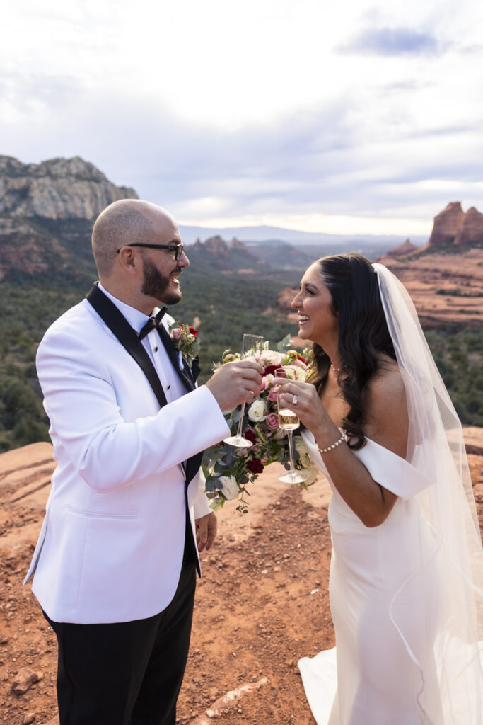 bride and groom with champagne glasses