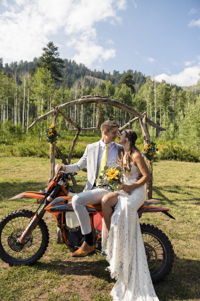 bride and groom riding dirtbike